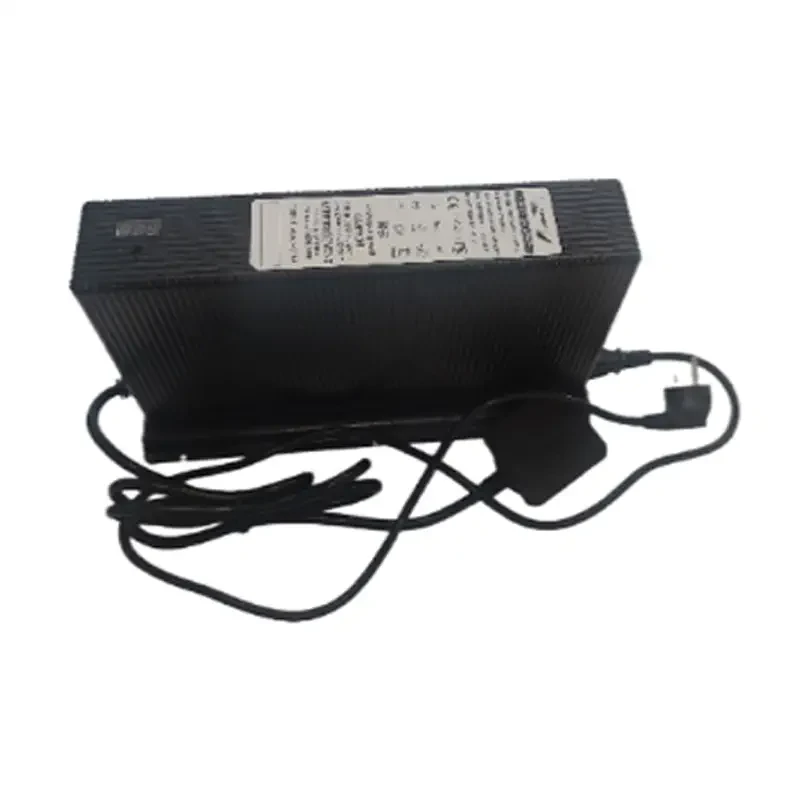 Unitree B2 Charger with Cables Unitree B2 charger three-quarter view with coiled AC and DC cables and wall plug, showing the black finned casing and rating label on a white background